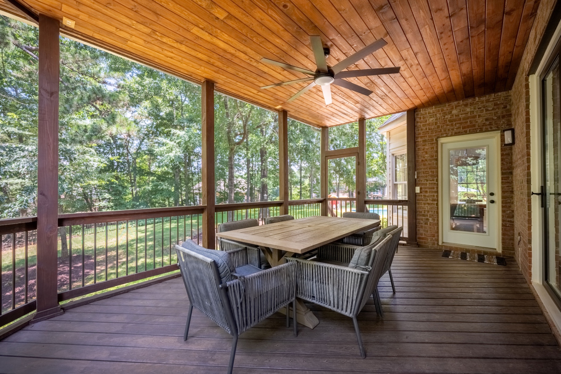 Expansive screened porch overlooking the backyard and pool.