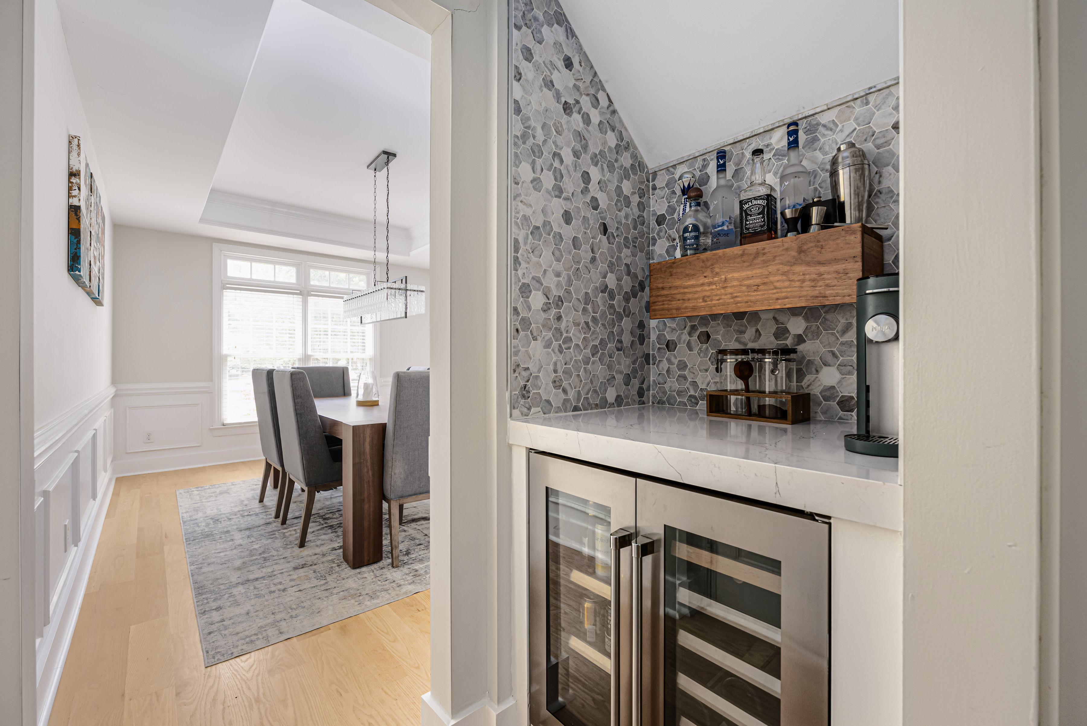 Dedicated bar area featuring a beverage refrigerator.